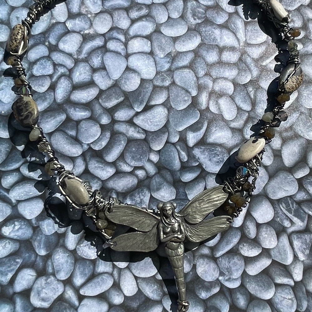 Handcrafted twisted wire choker necklace with large fairy charm.
